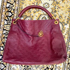 Louis Vuitton Empreinte Monogram leather in burgundy red